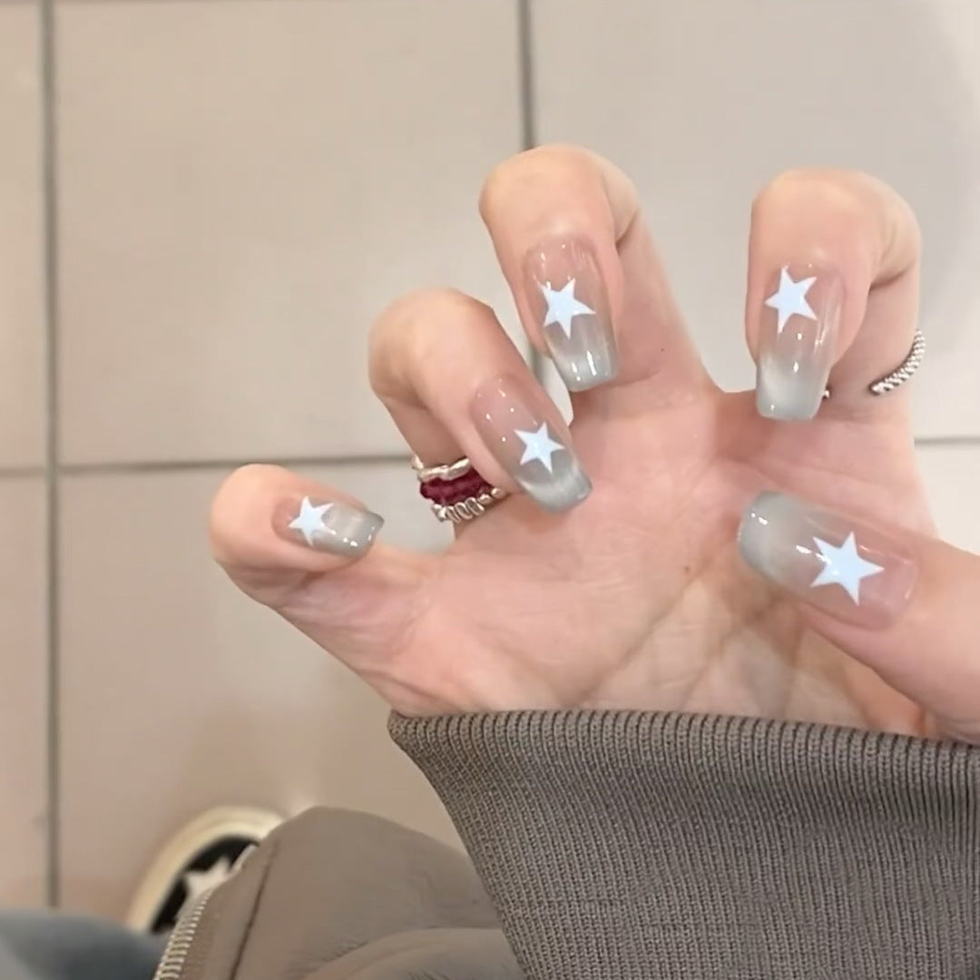 Artificial fingernails with star motif and ombre effect Stornfield