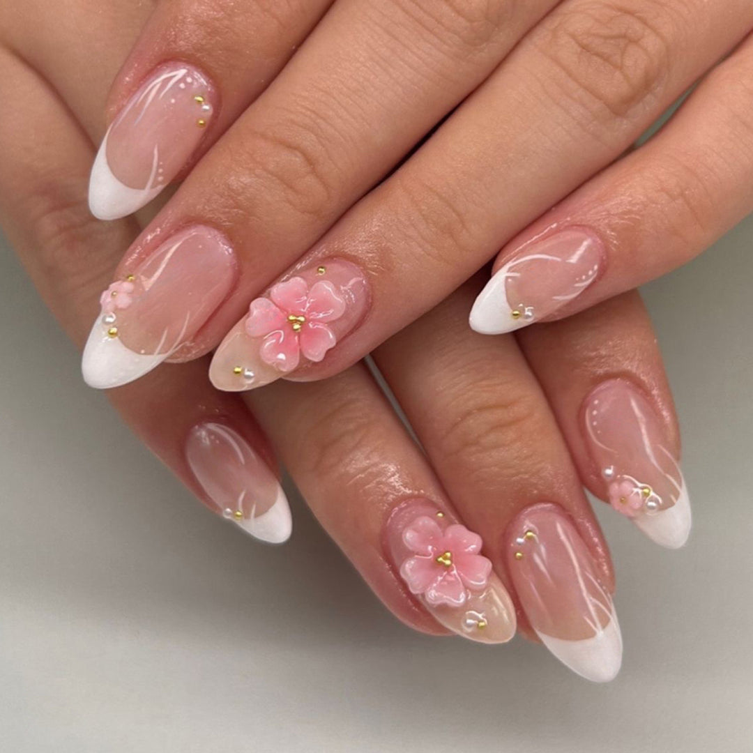 Artful stiletto nails with elegant floral design and glitter details Stornfield
