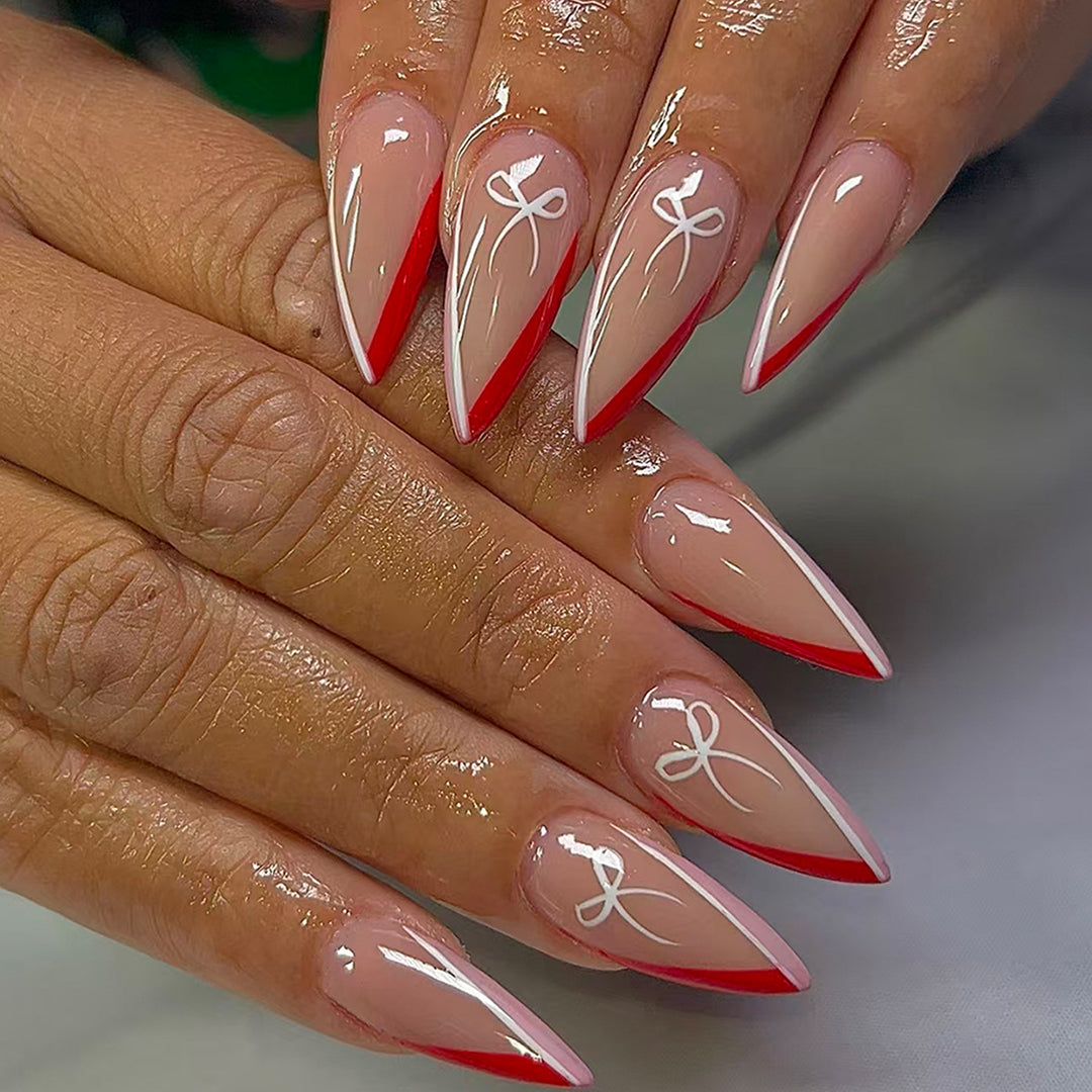 Artificial nails in elegant stiletto design with bow accents Stornfield