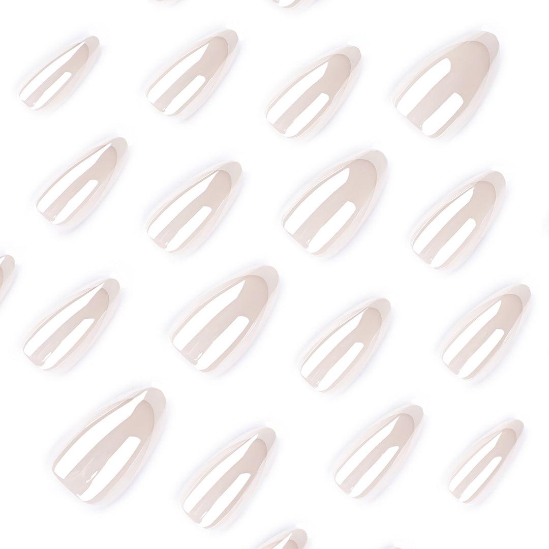 Artistic stiletto nails with elegant French tip embellishments Stornfield