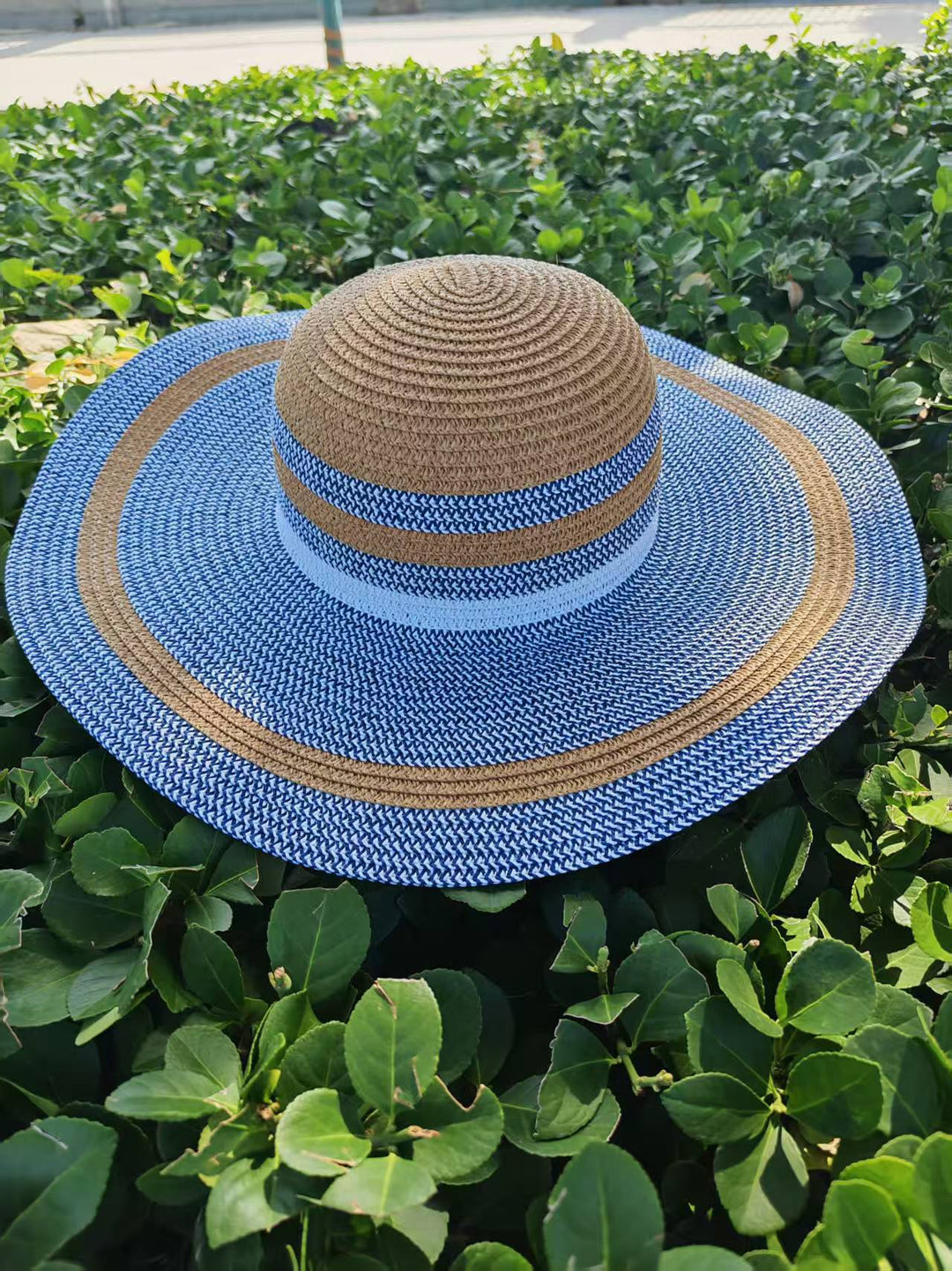 Elegant sun hat with wide brim and subtle stripe pattern Stornfield