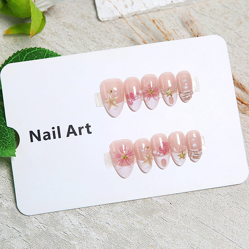 Elegant artificial nails with floral designs and glitter accents Stornfield