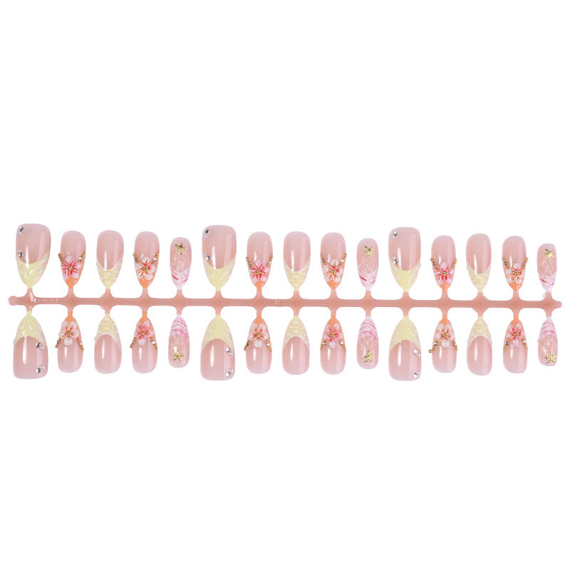 Artificial nail set with glamorous floral and glitter decorations Stornfield