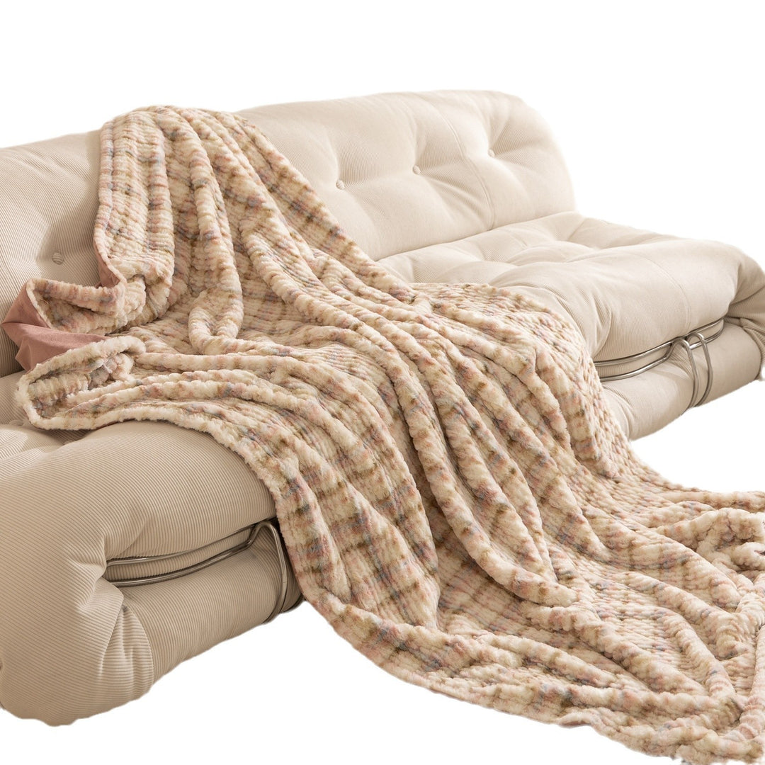 Cozy blanket made of luxurious synthetic fur with wavy texture and soft microfiber back Stornfield