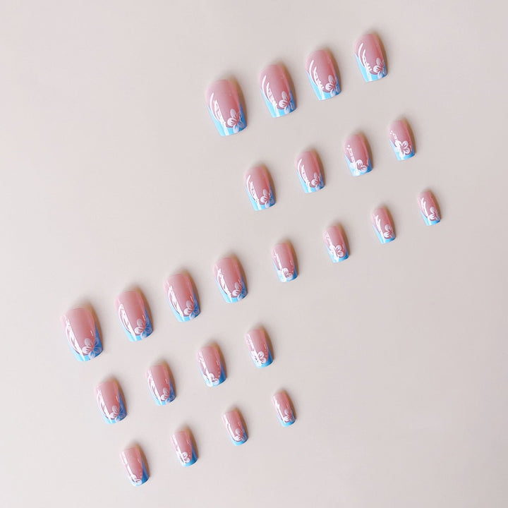 Acrylic nail set with floral designs and elegant tips Stornfield
