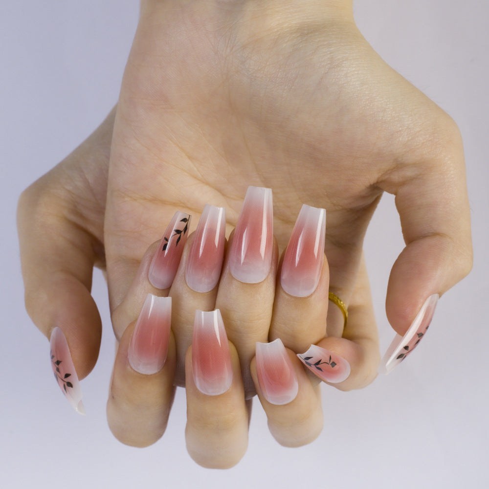 Press-on nails in elegant ombre design with floral accents Stornfield