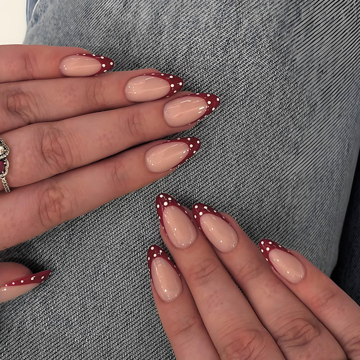 Nail art set with elegant red tips and playful dots Stornfield