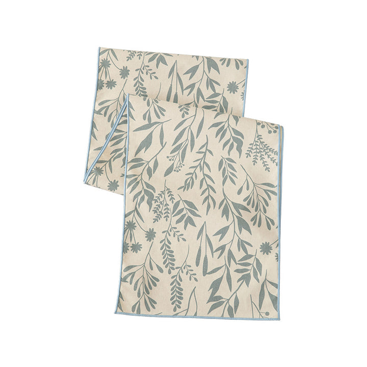 Woven table runner and placemat set made of cotton-linen with botanical scrolling pattern