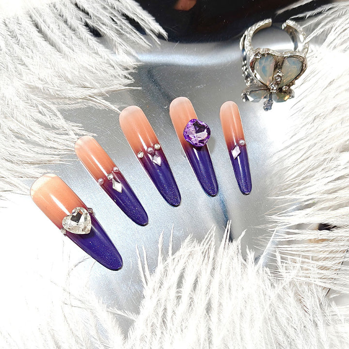 Artificial nails with glitter and elegant 3D applications Stornfield