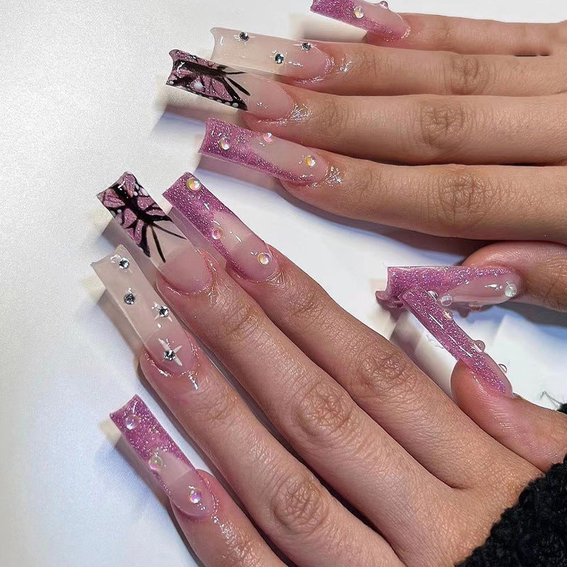 Artful stiletto nails with floral and glittering accents Stornfield