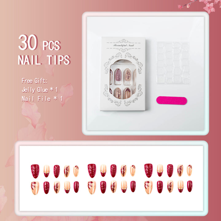 Artificial nail set with filigree golden decorations and romantic heart details Stornfield