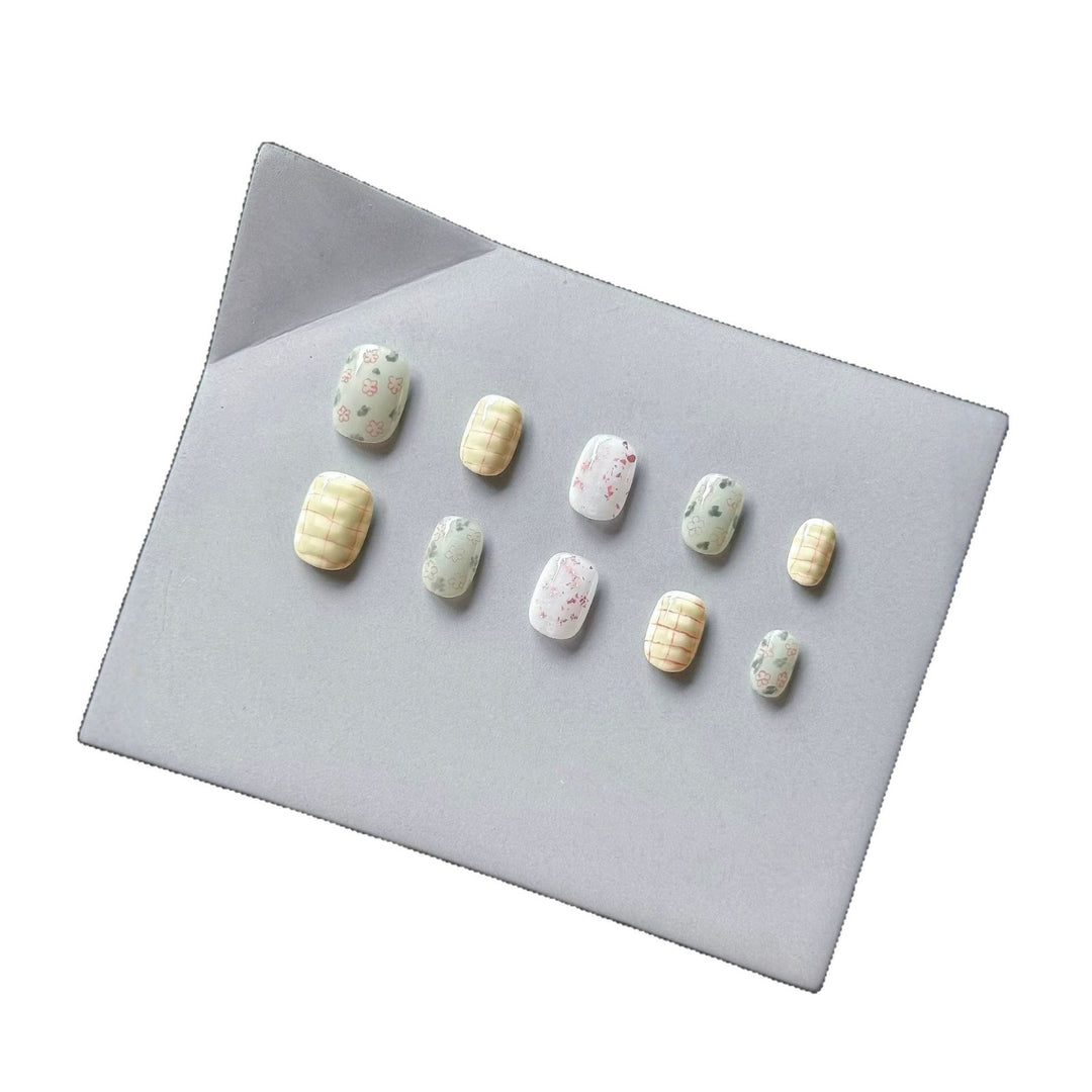 Artistic Press-On Nail Art Set with Floral and Abstract Patterns