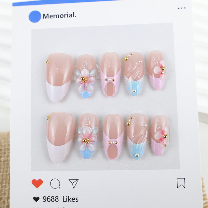 Artificial nail set with romantic floral motifs and elegant accents Stornfield