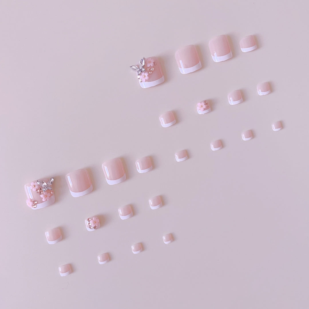 Acrylic nail set with elegant 3D flowers and glitter accents Stornfield