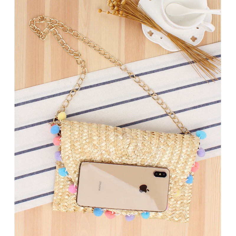 Clutch Bag Made of Handwoven Straw with Decorative Pompons Stornfield