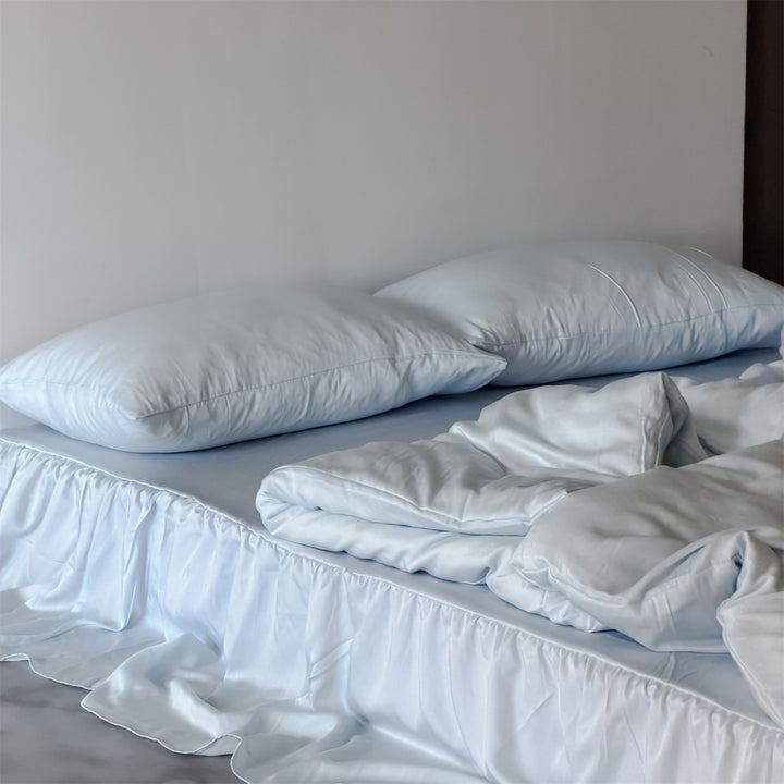 Bedding set with voluminous bed skirt and soft satin finish