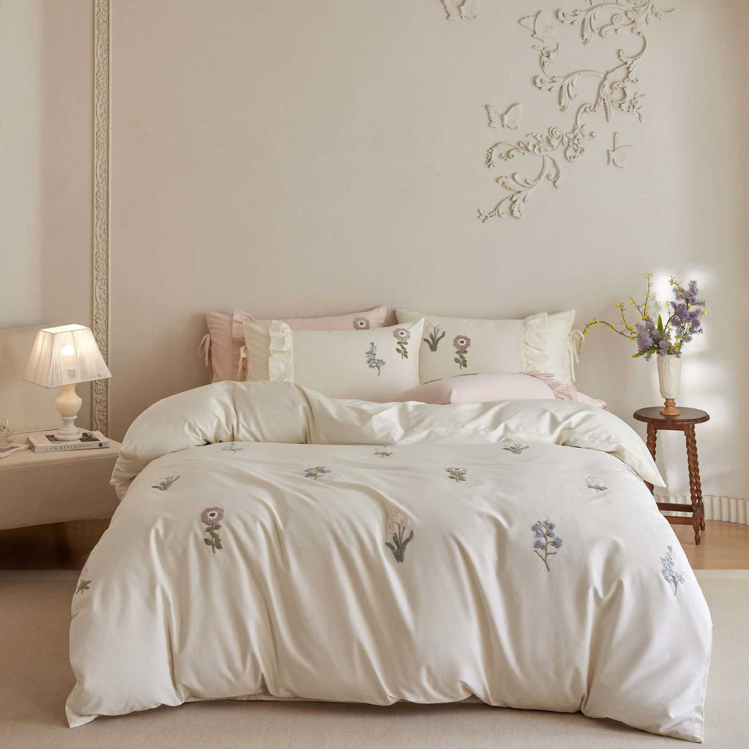 Cotton satin duvet cover set with embroidered wildflowers and decorative ruffle
