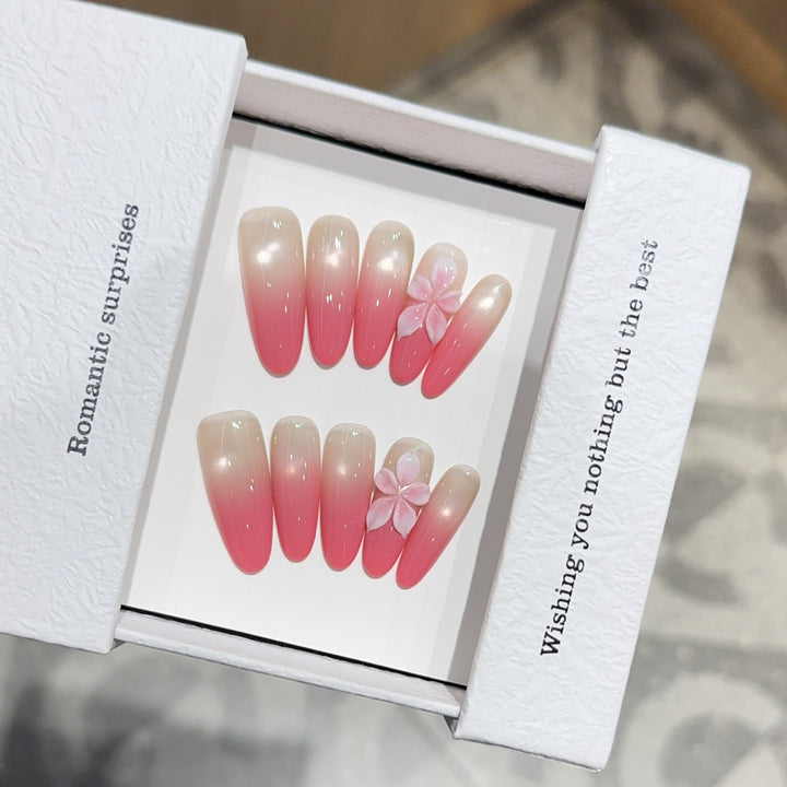 Artificial nails with romantic ombre design and floral accents Stornfield