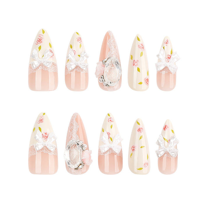 Artful stiletto nails with floral accents and glitter accents Stornfield