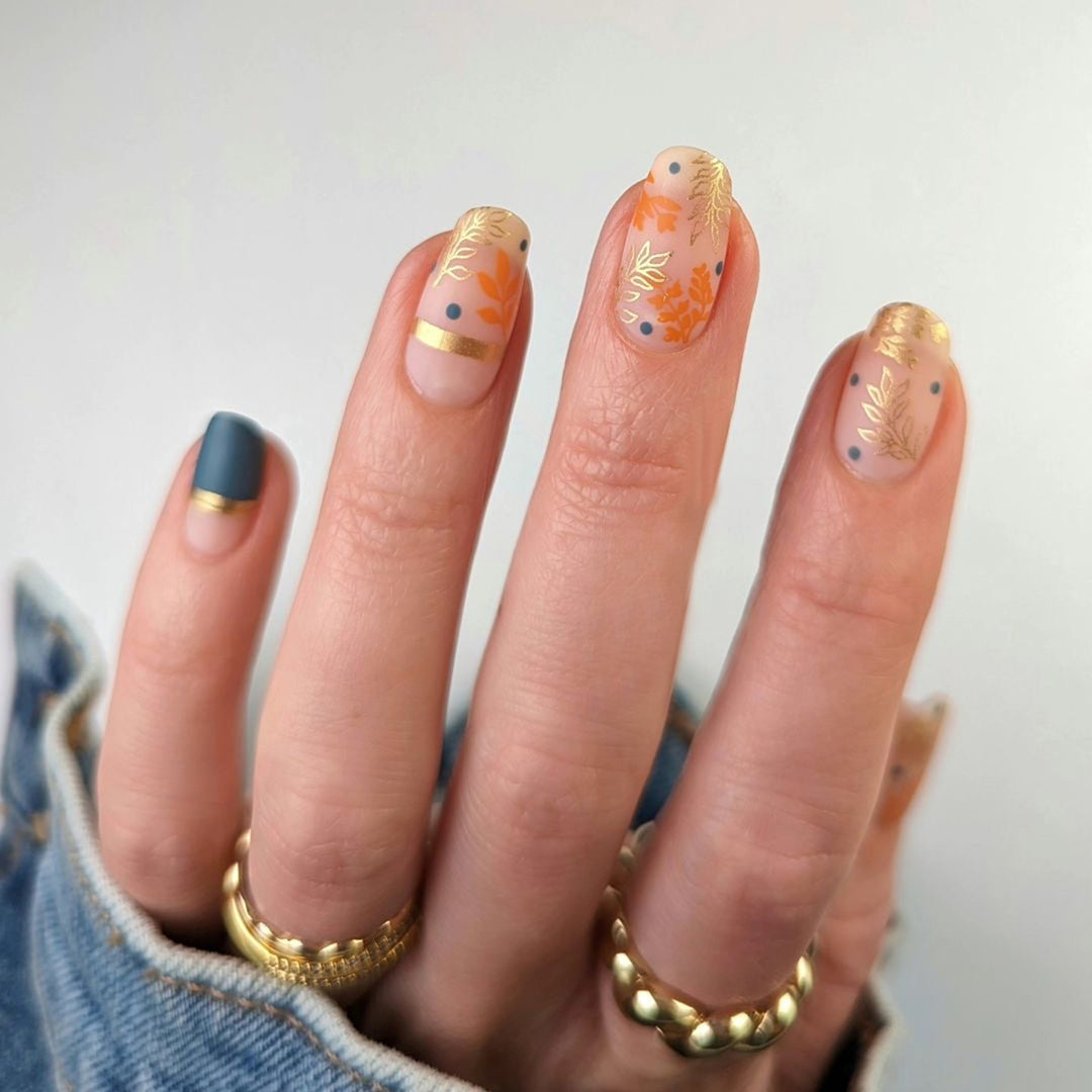 Artistic nail design with floral and golden accent Stornfield