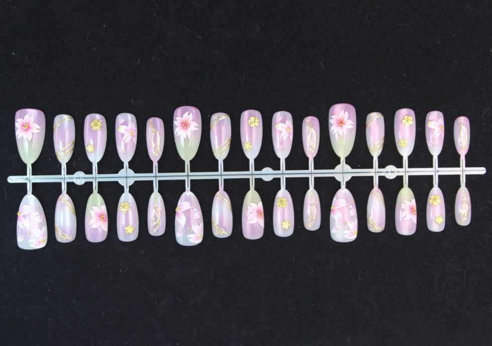 Artificial nails with floral design and gold accents Stornfield