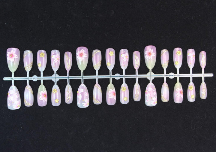 Artificial nails with floral design and gold accents Stornfield