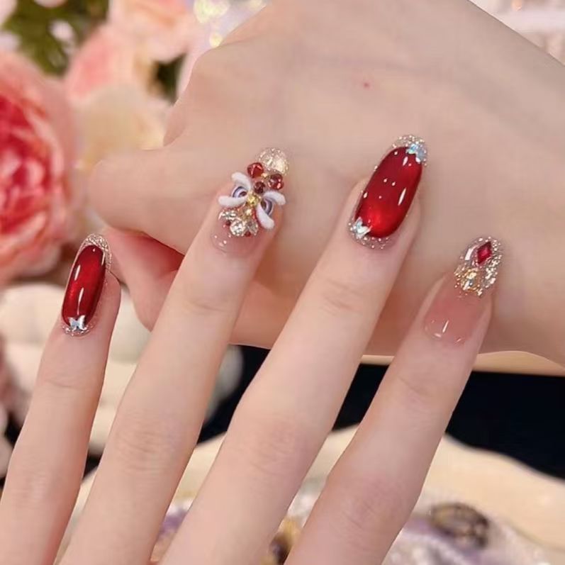 Artistic Rhinestone-Embellished Nail Extensions Stornfield