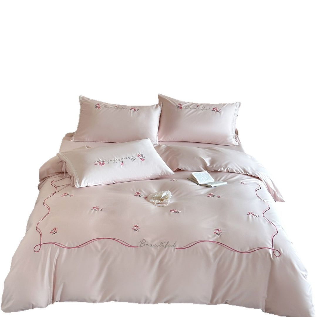 Elegant satin bedding with delicate rose embroidery and tie band detail