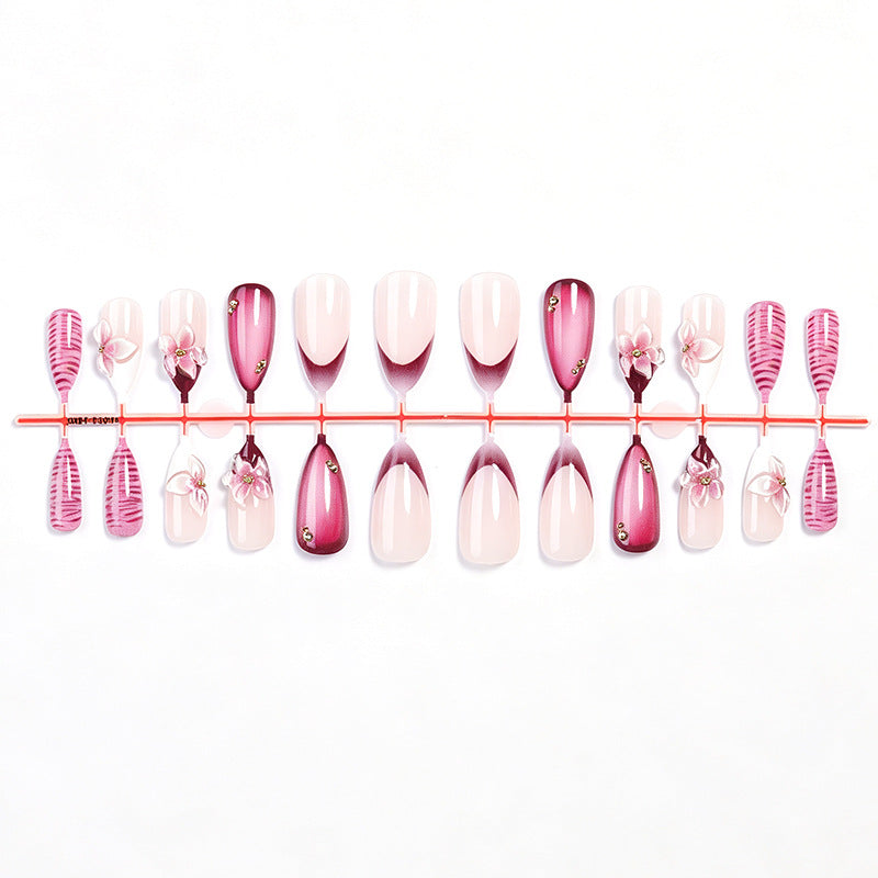 Artificial nail set with floral accents and ombre effect Stornfield