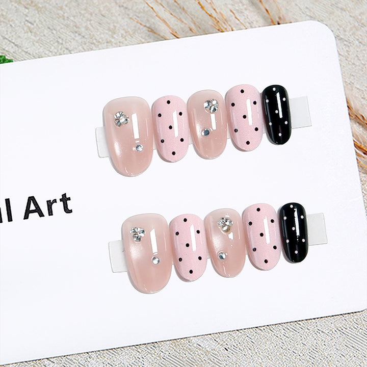 Acrylic nail set with glamorous rhinestone accents and modern dots Stornfield