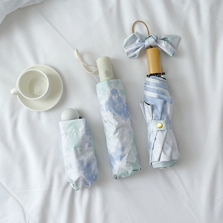 Ladies elegant folding umbrella with modern cloud pattern Stornfield