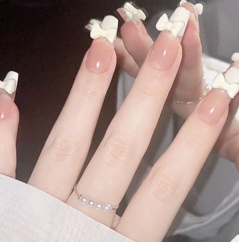 Elegant nail design with pearl embellishment Stornfield