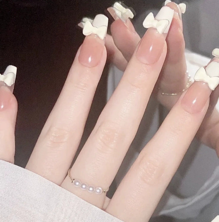 Elegant nail design with pearl embellishment Stornfield