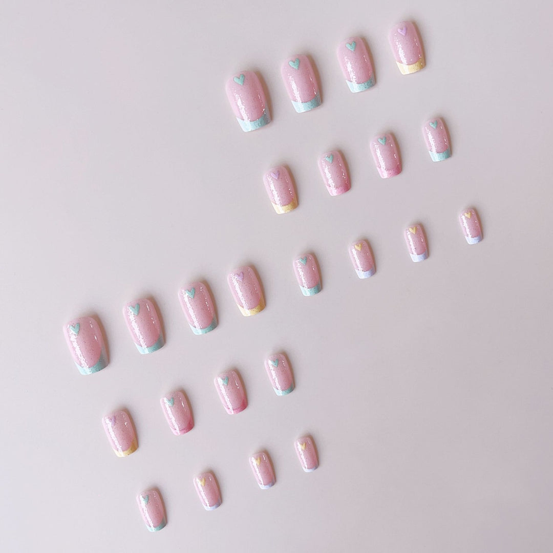 Artificial nail set with playful color gradients and heart motifs Stornfield