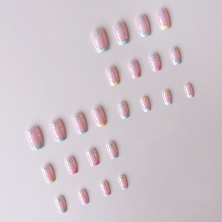 Artificial nail set with playful color gradients and heart motifs Stornfield