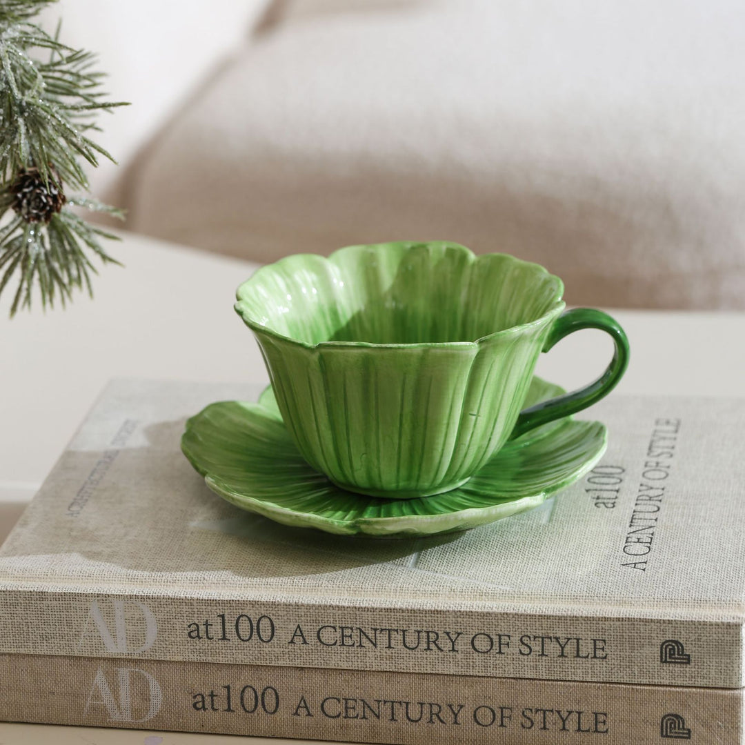 Ceramic mug with saucer in flower shape