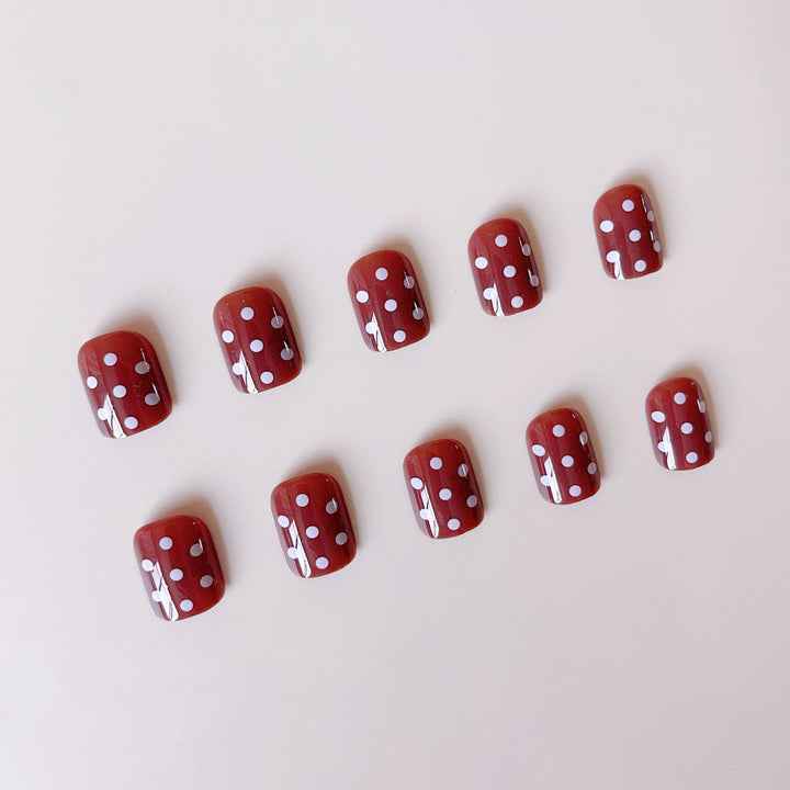 Acrylic nail set with stylish chocolate spots and elegant dots Stornfield