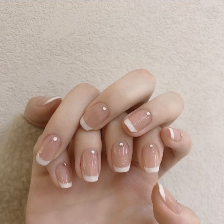 Artificial nails with elegant French tip and rhinestone accents Stornfield