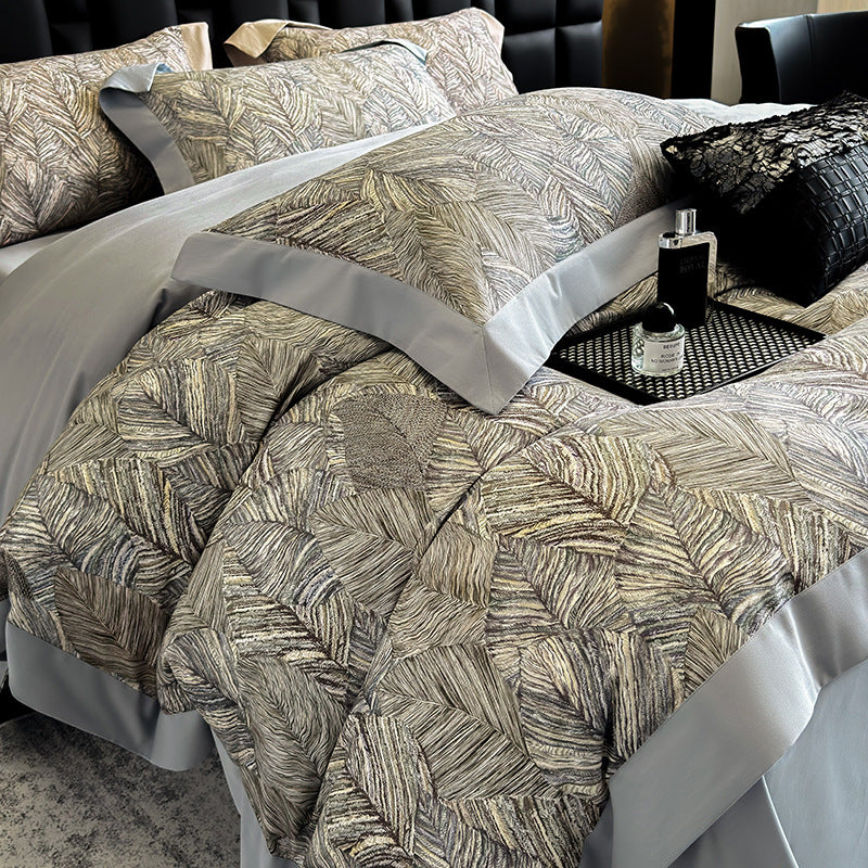 Elegant bed linen set made of cotton satin with a subtle leaf pattern and contrast piping