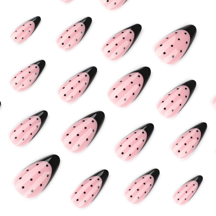 Artistic stiletto nails with black dot pattern Stornfield