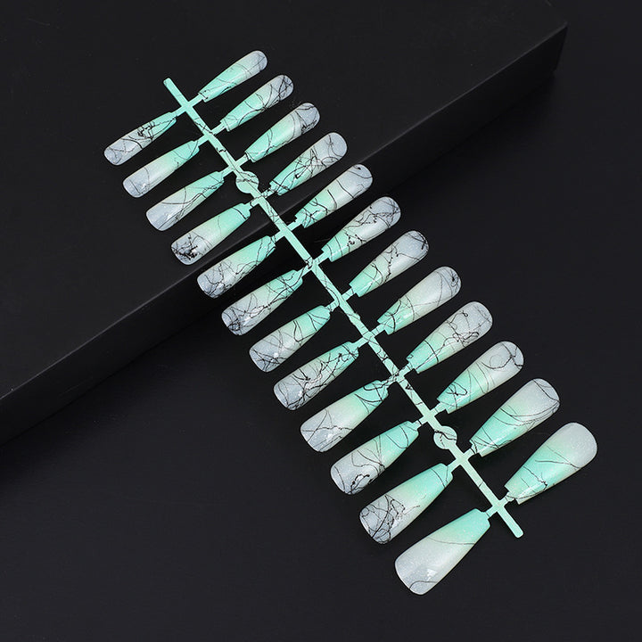 Artificial nails in modern ombre design with marbled accents Stornfield