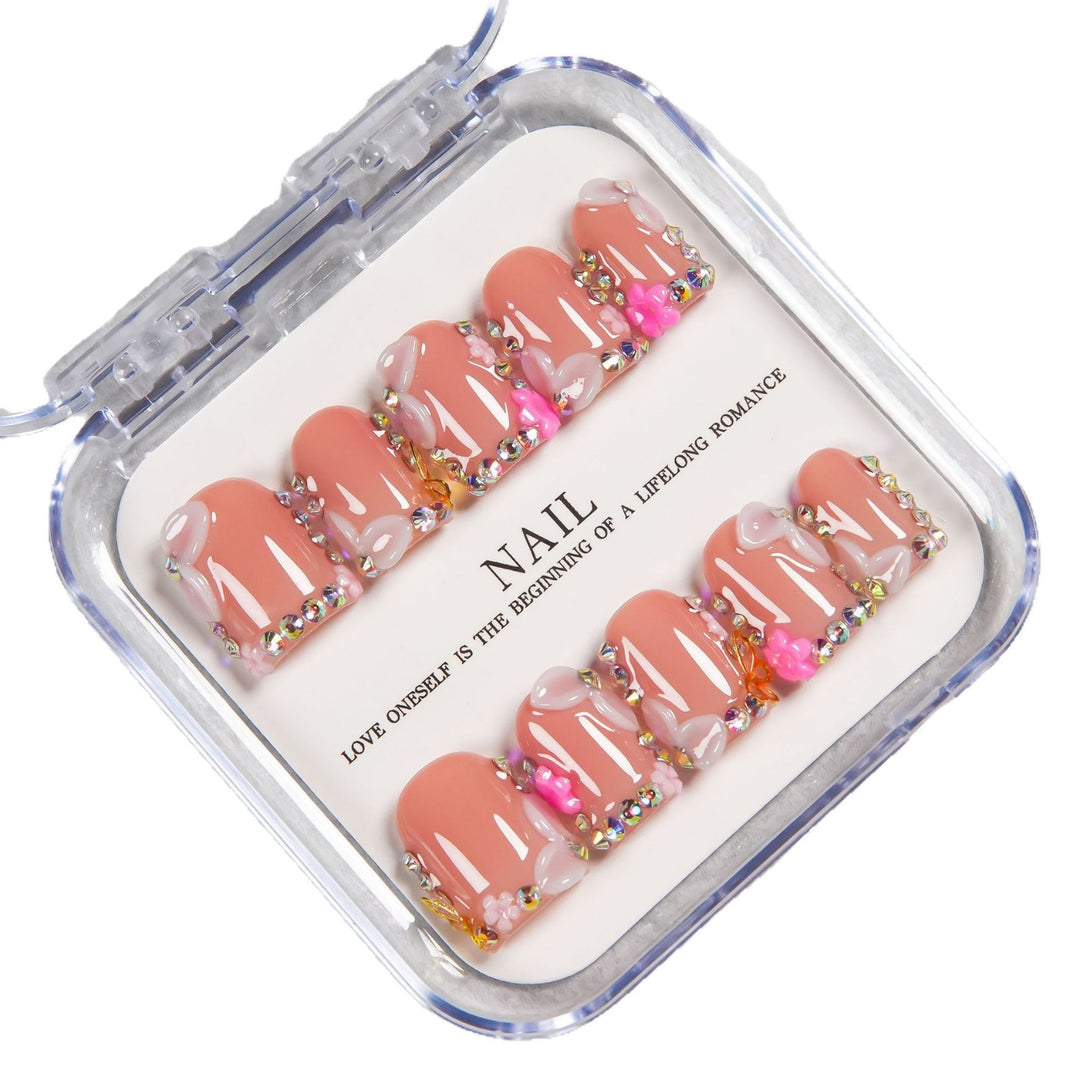 Decorative Press-On Nail Set with Soft Pink Accents and Gem Details