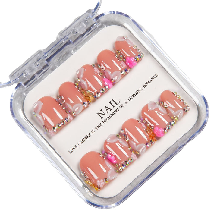 Decorative Press-On Nail Set with Soft Pink Accents and Gem Details