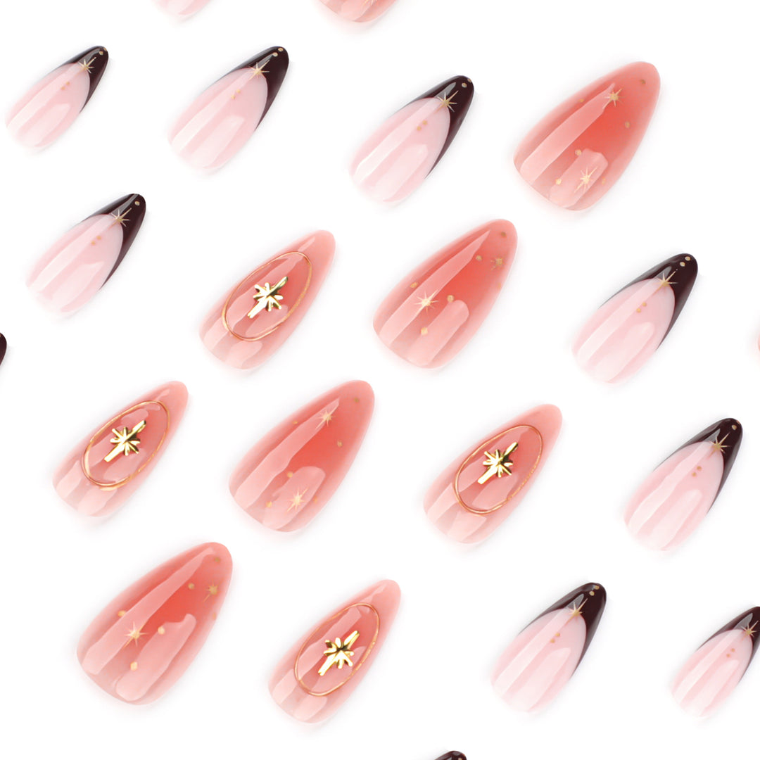 Artful stiletto nails with elegant gold embellishments Stornfield