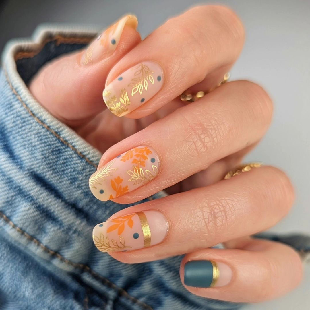 Artistic nail design with floral and golden accent Stornfield