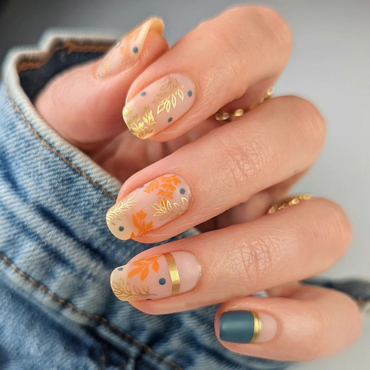 Artistic nail design with floral and golden accent Stornfield