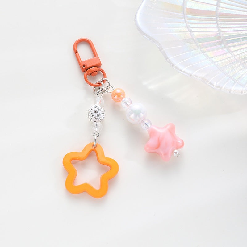 Playful keychain with floral and star motif Stornfield