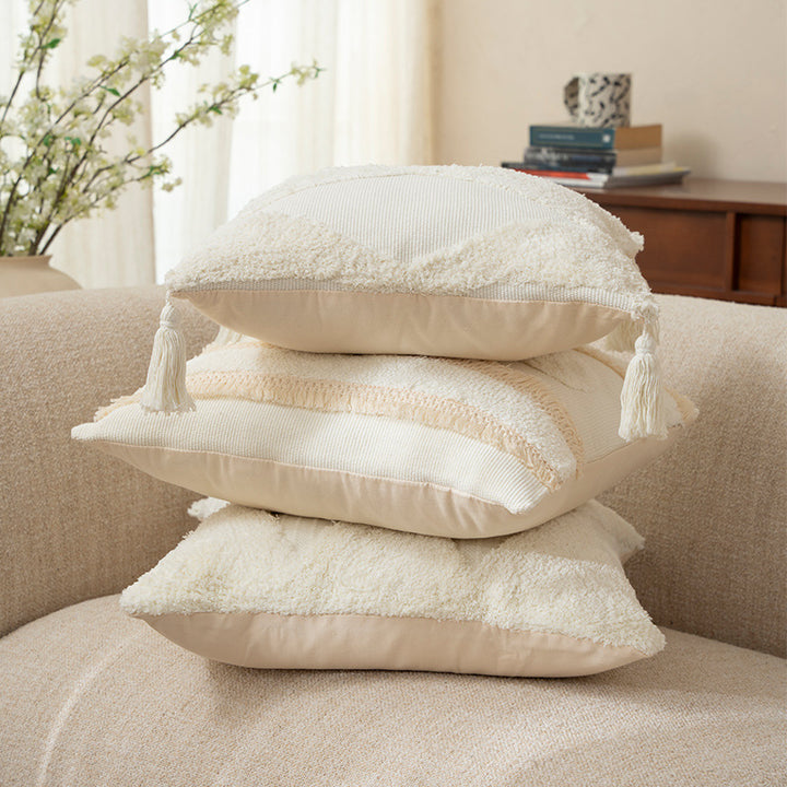 Square cushions with structured boucle look, quilted tufting and decorative tassels