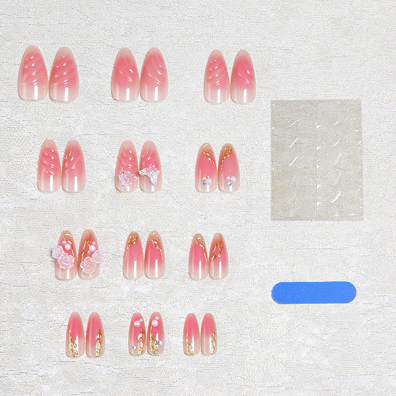 Artificial nail creation with floral 3D details and glitter accents Stornfield