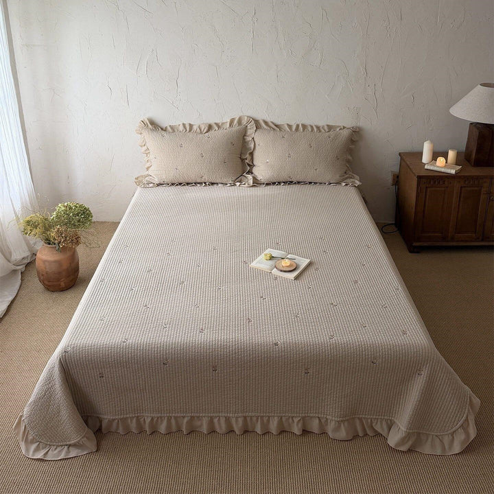 Quilted bedspread and cushion set with frill and delicate flower embroidery